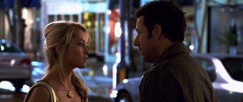 Movie still from “Bedtime Stories” (2008), directed by Adam Shankman – A man and a woman standing next to each other on the street; Close Up shot, Over the shoulder angle