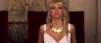 Movie still from “Bedtime Stories” (2008), directed by Adam Shankman – A woman with long blonde hair wearing a gold necklace; Close Up shot, Low angle