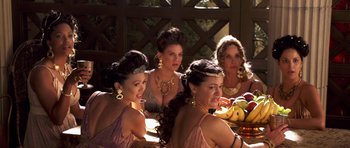 Movie still from “Bedtime Stories” (2008), directed by Adam Shankman – A group of women sitting around a table; Medium shot, Over the shoulder angle