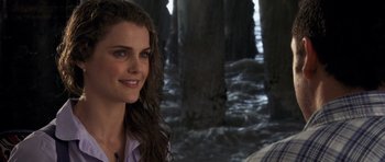Movie still from “Bedtime Stories” (2008), directed by Adam Shankman – A woman standing next to a man on a pier; Close Up shot, Over the shoulder angle