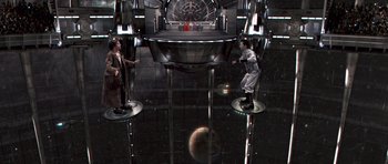 Movie still from “Bedtime Stories” (2008), directed by Adam Shankman – Two men are standing in a room with a mirror; Wide shot, Overhead angle