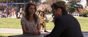 Movie still from “Bedtime Stories” (2008), directed by Adam Shankman – A man and a woman sitting at a table outside; Medium shot, Over the shoulder angle