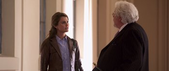 Movie still from “Bedtime Stories” (2008), directed by Adam Shankman – A woman and a man are talking in a room; Medium shot, Over the shoulder angle