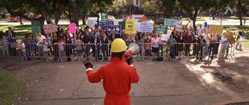 Movie still from “Bedtime Stories” (2008), directed by Adam Shankman – A man in an orange suit and a yellow hard hat; Extreme Wide shot, High angle