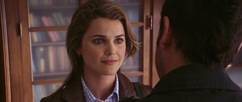 Movie still from “Bedtime Stories” (2008), directed by Adam Shankman – A person looking at the camera; Close Up shot, Over the shoulder angle