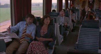 Movie still from “Before Sunrise” (1995), directed by Richard Linklater – A group of people sitting in a train car; Medium shot, High angle