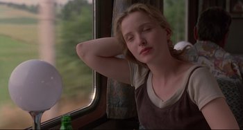 Movie still from “Before Sunrise” (1995), directed by Richard Linklater – A woman sitting on a train looking out the window; Close Up shot, Low angle