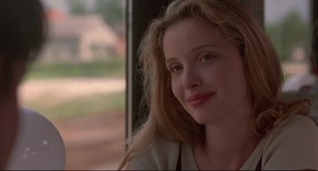 Movie still from “Before Sunrise” (1995), directed by Richard Linklater – A person sitting in a room near a window; Close Up shot, Over the shoulder angle