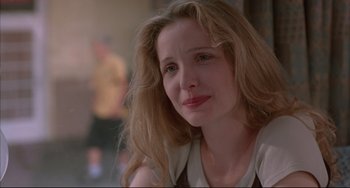 Movie still from “Before Sunrise” (1995), directed by Richard Linklater – A person with long blonde hair; Close Up shot, Over the shoulder angle