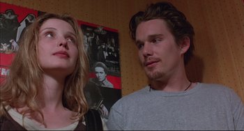 Movie still from “Before Sunrise” (1995), directed by Richard Linklater – A man and a woman standing next to each other in a room; Close Up shot, Low angle