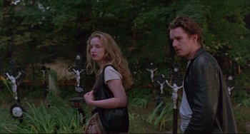 Movie still from “Before Sunrise” (1995), directed by Richard Linklater – A man and a woman standing next to each other in a field; Medium shot, Over the shoulder angle
