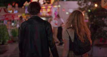 Movie still from “Before Sunrise” (1995), directed by Richard Linklater – A man and a woman holding hands while walking down a street; Medium shot, Over the shoulder angle