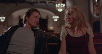 Movie still from “Before Sunrise” (1995), directed by Richard Linklater – A man and a woman sitting next to each other; Medium shot, Low angle