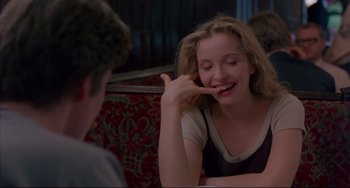 Movie still from “Before Sunrise” (1995), directed by Richard Linklater – A woman sitting in front of a man at a table; Close Up shot, Over the shoulder angle