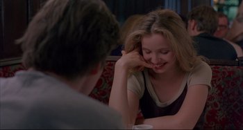 Movie still from “Before Sunrise” (1995), directed by Richard Linklater – A woman sitting in front of a man at a table; Close Up shot, Over the shoulder angle