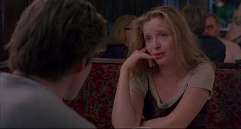 Movie still from “Before Sunrise” (1995), directed by Richard Linklater – A woman sitting in front of a man at a table; Close Up shot, Over the shoulder angle