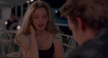 Movie still from “Before Sunrise” (1995), directed by Richard Linklater – A woman sitting in front of a man at a table; Close Up shot, Over the shoulder angle