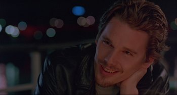 Movie still from “Before Sunrise” (1995), directed by Richard Linklater – A person wearing a leather jacket; Close Up shot, Over the shoulder angle
