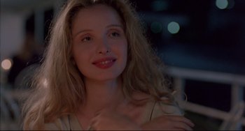 Movie still from “Before Sunrise” (1995), directed by Richard Linklater – A person with long blonde hair; Close Up shot, Over the shoulder angle