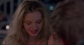 Movie still from “Before Sunrise” (1995), directed by Richard Linklater – A woman's face as a man looks on; Close Up shot, Over the shoulder angle