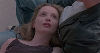 Movie still from “Before Sunrise” (1995), directed by Richard Linklater – A woman laying on the ground looking up at the sky; Close Up shot, Overhead angle