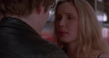 Movie still from “Before Sunrise” (1995), directed by Richard Linklater – A young man and a young woman looking at one another; Close Up shot, Over the shoulder angle