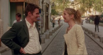 Movie still from “Before Sunset” (2004), directed by Richard Linklater – A man and a woman talking on the sidewalk; Medium shot, Over the shoulder angle