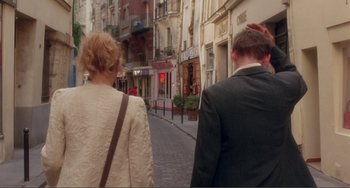 Movie still from “Before Sunset” (2004), directed by Richard Linklater – A man and a woman walking down a street; Medium shot, Over the shoulder angle
