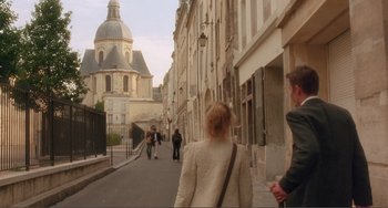 Movie still from “Before Sunset” (2004), directed by Richard Linklater – People walking down a street in a european city; Wide shot, High angle