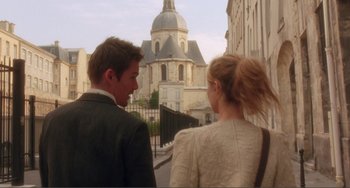Movie still from “Before Sunset” (2004), directed by Richard Linklater – A man and a woman walking down a street; Wide shot, Over the shoulder angle