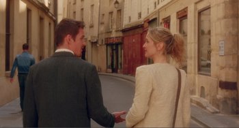 Movie still from “Before Sunset” (2004), directed by Richard Linklater – A man and a woman holding hands on the street; Medium shot, Over the shoulder angle