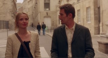 Movie still from “Before Sunset” (2004), directed by Richard Linklater – A man and a woman walking down a street; Medium shot, Over the shoulder angle