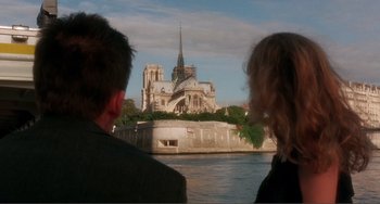 Movie still from “Before Sunset” (2004), directed by Richard Linklater – Two people looking at a cathedral from a boat on a river; Wide shot, Over the shoulder angle