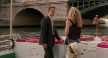 Movie still from “Before Sunset” (2004), directed by Richard Linklater – A man and a woman standing next to each other on the side of a boat; Wide shot, Over the shoulder angle