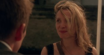Movie still from “Before Sunset” (2004), directed by Richard Linklater – A woman with blonde hair is talking to a man; Close Up shot, Over the shoulder angle