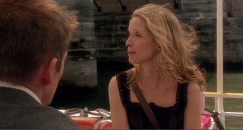 Movie still from “Before Sunset” (2004), directed by Richard Linklater – A woman sitting next to a man in front of a brick wall; Close Up shot, Over the shoulder angle