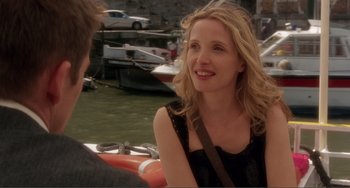 Movie still from “Before Sunset” (2004), directed by Richard Linklater – A woman sitting next to a man on a boat; Close Up shot, Over the shoulder angle