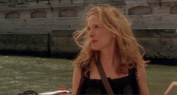 Movie still from “Before Sunset” (2004), directed by Richard Linklater – A woman with long blonde hair is standing in the water; Close Up shot, Over the shoulder angle
