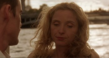 Movie still from “Before Sunset” (2004), directed by Richard Linklater – A person with curly hair; Close Up shot, Low angle