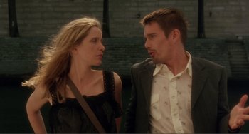 Movie still from “Before Sunset” (2004), directed by Richard Linklater – A man and a woman standing next to each other; Medium shot, Low angle