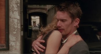 Movie still from “Before Sunset” (2004), directed by Richard Linklater – A man and a woman embracing each other; Close Up shot, Over the shoulder angle