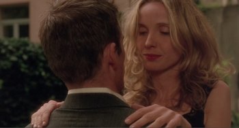 Movie still from “Before Sunset” (2004), directed by Richard Linklater – A man and a woman embracing each other in front of a mirror; Close Up shot, Over the shoulder angle