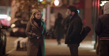 Movie still from “Before We Go” (2014), directed by Chris Evans – A woman and a man standing next to each other on the sidewalk; Medium shot, Over the shoulder angle