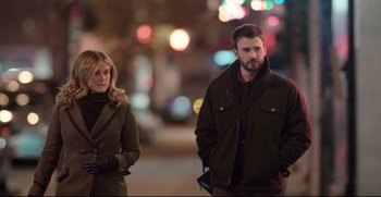 Movie still from “Before We Go” (2014), directed by Chris Evans – A man and a woman standing next to each other on the sidewalk; Medium shot, Over the shoulder angle