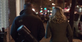 Movie still from “Before We Go” (2014), directed by Chris Evans – A man and a woman walking down a street at night; Medium shot, Over the shoulder angle