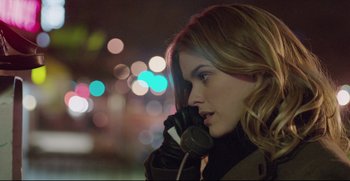 Movie still from “Before We Go” (2014), directed by Chris Evans – A beautiful young woman talking on a cell phone; Close Up shot, Low angle