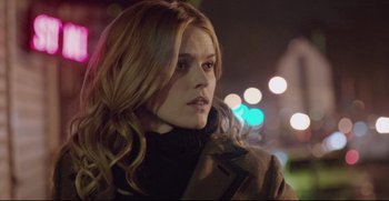 Movie still from “Before We Go” (2014), directed by Chris Evans – A woman with long blonde hair wearing a brown coat; Close Up shot, Over the shoulder angle