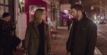 Movie still from “Before We Go” (2014), directed by Chris Evans – A man and a woman standing next to each other on the sidewalk; Medium shot, Over the shoulder angle