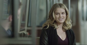 Movie still from “Before We Go” (2014), directed by Chris Evans – A beautiful young lady sitting in front of a window; Close Up shot, Over the shoulder angle