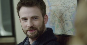 Movie still from “Before We Go” (2014), directed by Chris Evans – A person with a map in the background; Close Up shot, Over the shoulder angle